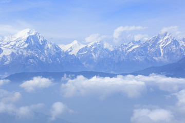 Obraz na płótnie Canvas beautiful rolling clouds and snow mountain landscape