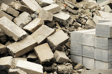 piles of damaged bricks in construction site
