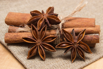 Star anise and cinnamon sticks on wooden table, seasoning for cooking