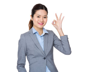 Asian businesswoman showing ok sign gesture