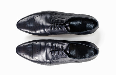 Black leather mens shoes isolated top view