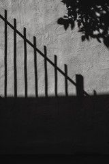 Fence Shadow on Stucco Wall