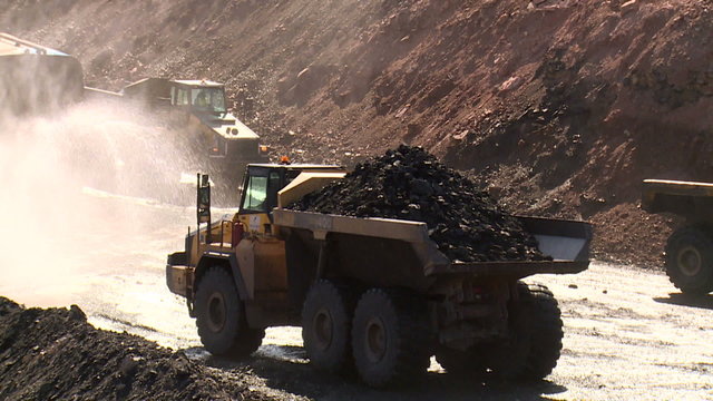 dumper trucks on a coal mine