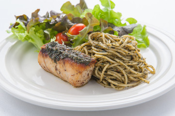 italian pasta spaghetti with pesto sauce and striped bass , Clos