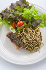 italian pasta spaghetti with pesto sauce and striped bass , Clos