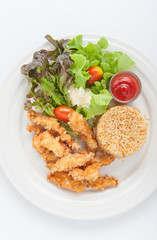 Fried chicken and garlic fried rice on the white plate