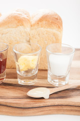 breakfast with toast fruit jam and butter on wood table