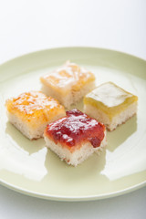 Mix fruit, blueberry, orange fruit jam spread on bread toast ove