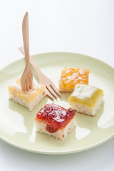 Mix fruit, blueberry, orange fruit jam spread on bread toast ove