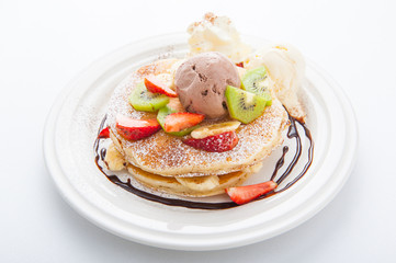 The Original pancakes with banana,ice cream and whipped cream on