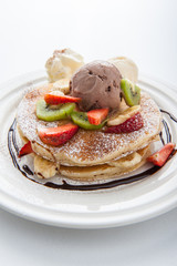 The Original pancakes with banana,ice cream and whipped cream on