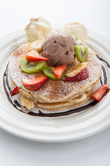 The Original pancakes with banana,ice cream and whipped cream on