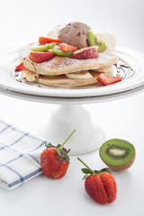 The Original pancakes with banana,ice cream and whipped cream on