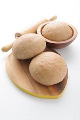 Wholewheat bread rolls on white background