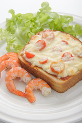Wheat bread toasts with cream cheese and shrimp selective focus
