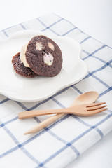 brownie dessert with ice cream on a white plate.