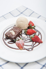Brownie with ice cream and strawberry, delicious dessert