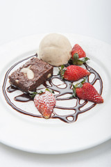 Brownie with ice cream and strawberry, delicious dessert