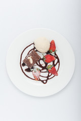Brownie with ice cream and strawberry, delicious dessert