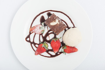 Brownie with ice cream and strawberry, delicious dessert