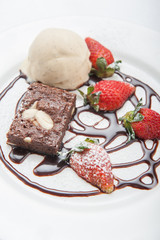 Brownie with ice cream and strawberry, delicious dessert