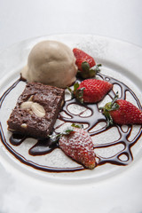 Brownie with ice cream and strawberry, delicious dessert