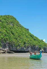Plakat Beach and the mountains and the blue sky, and fishing boats.Thai