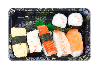 Sushi set in stylish tray isolated on white
