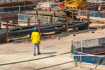 Construction workers are bearing wood, to be unity