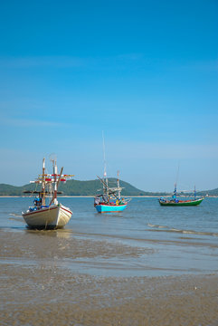 Small fishing boats on the beach in Phetchaburi