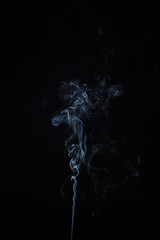 Abstract smoke moves on a black background. Design element. Abstract texture.
