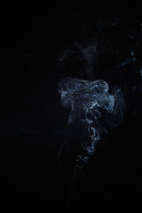Abstract smoke moves on a black background. Design element. Abstract texture.
