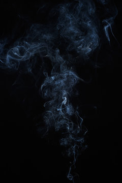 Abstract smoke moves on a black background. Design element. Abstract texture.