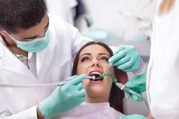 dentist curing a girls teeth