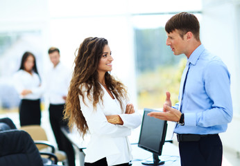 Business - meeting in office, two managers are discussing a docu