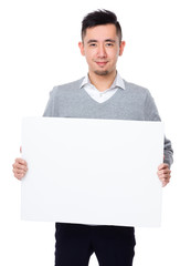 Businessman showing the white banner