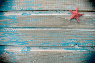 Star fish on wooden table background