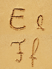 Sand font or letter set or collection on an exotic beach near the sea in summer