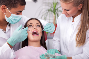 Dentist give syringe anesthetize  to his patient