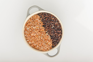 Three variety of rice: wild rice, red rice, and white rice. Shallow DOF