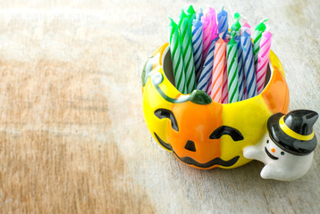 pumpkin cup and colorful candle for happy halloween