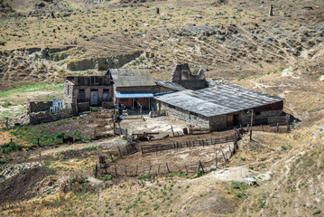 small farm seen from ancient rock-hewn town called Uplistsikhe in Georgia