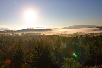 An aerial view of a hot air balloon floating over the Vermont country side ..