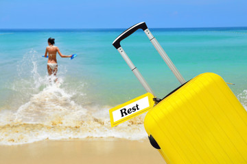 Rest. Suitcase with label at sea.