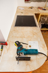 Installing new hob in modern kitchen