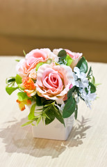 Artificial flowers in vase.