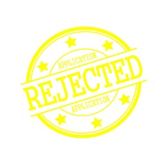 application rejected yellow stamp text on yellow circle on a white background and star