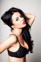 Fototapeta premium Fashion shoot of sexy younge woman wearing black lacy bra