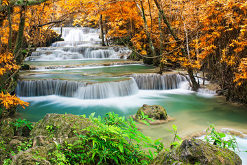 Amazing waterfall in autumn forest 