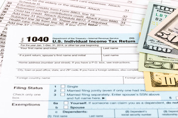 Tax form with banknote taxation concept